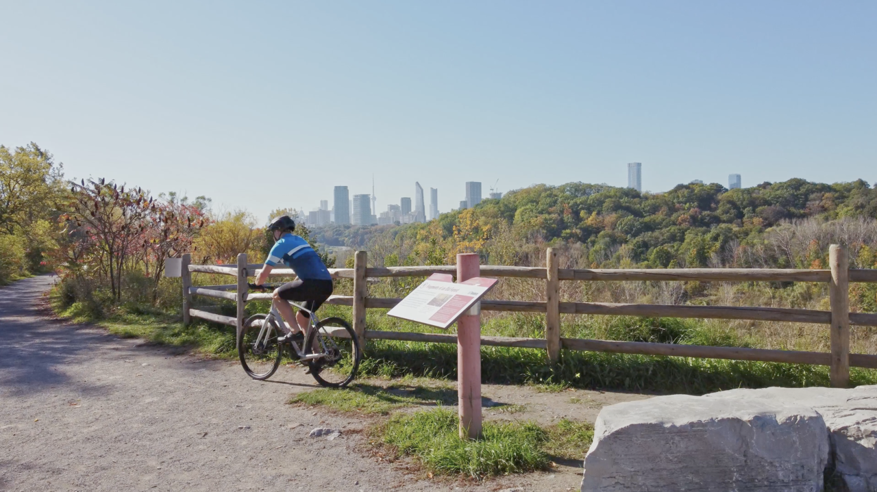 Bike Rider with Concord Sky in Toronto cityscape.png