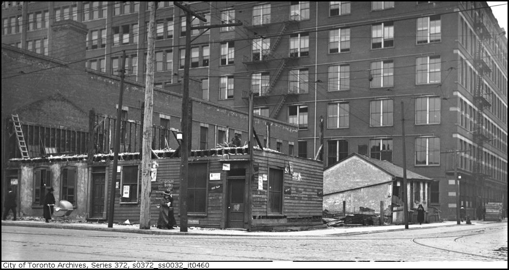 Slum housing - northeast corner of Terauley (now Bay St) and Louisa St. (T. Eaton Co. factory ...jpg